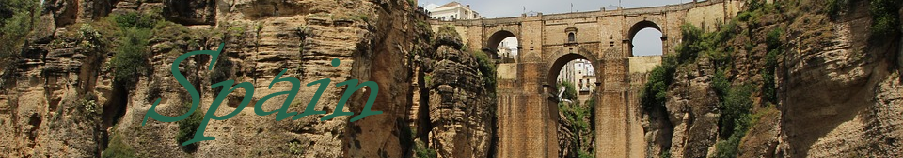 A logo that has the wording Spain on it and the background being a bridge